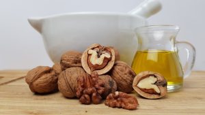 walnut oil, nuts, pestle
